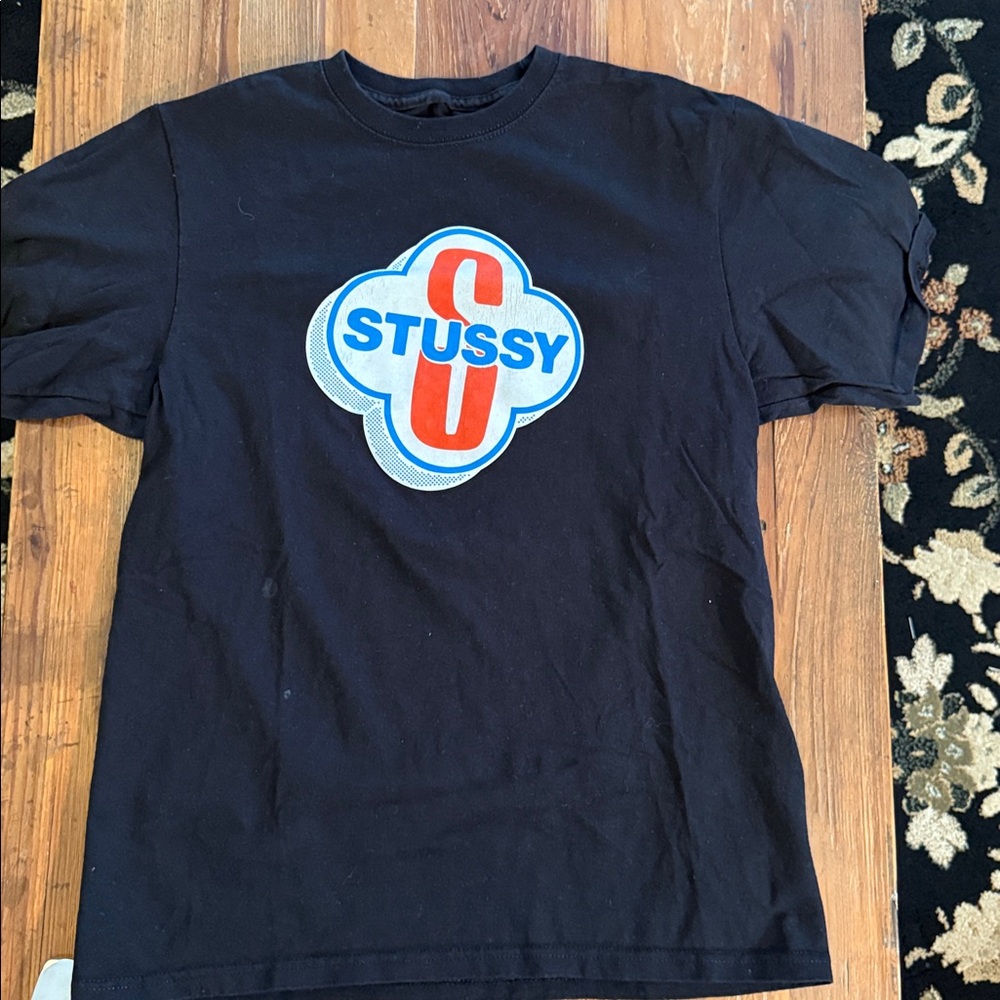 Stussy Black Tee. 2 small imperfections as pictured. 
P2P 17 1/2”